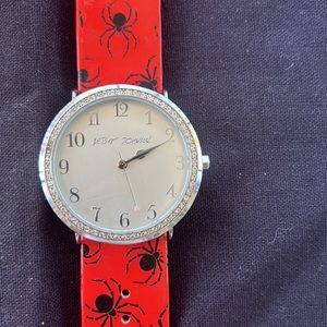 Wristwatch for all Spider-Man fans Betsy Johnson red and black silver face.